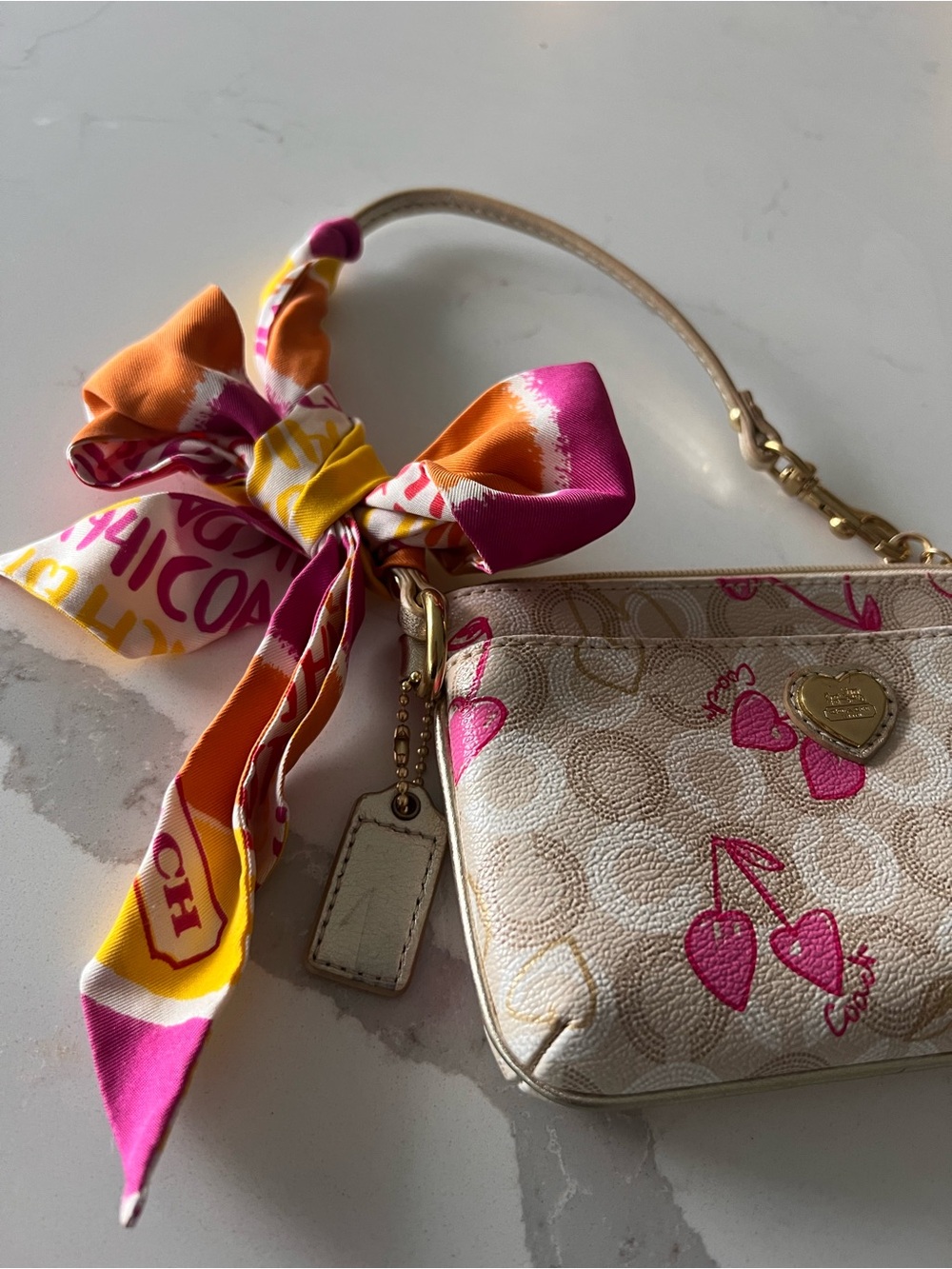 Coach Beige Signature Wristlet with Pink Cherry Heart Print